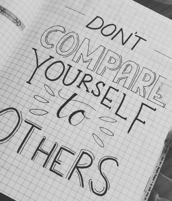 journal page that has "don't compare yourself to others" written out