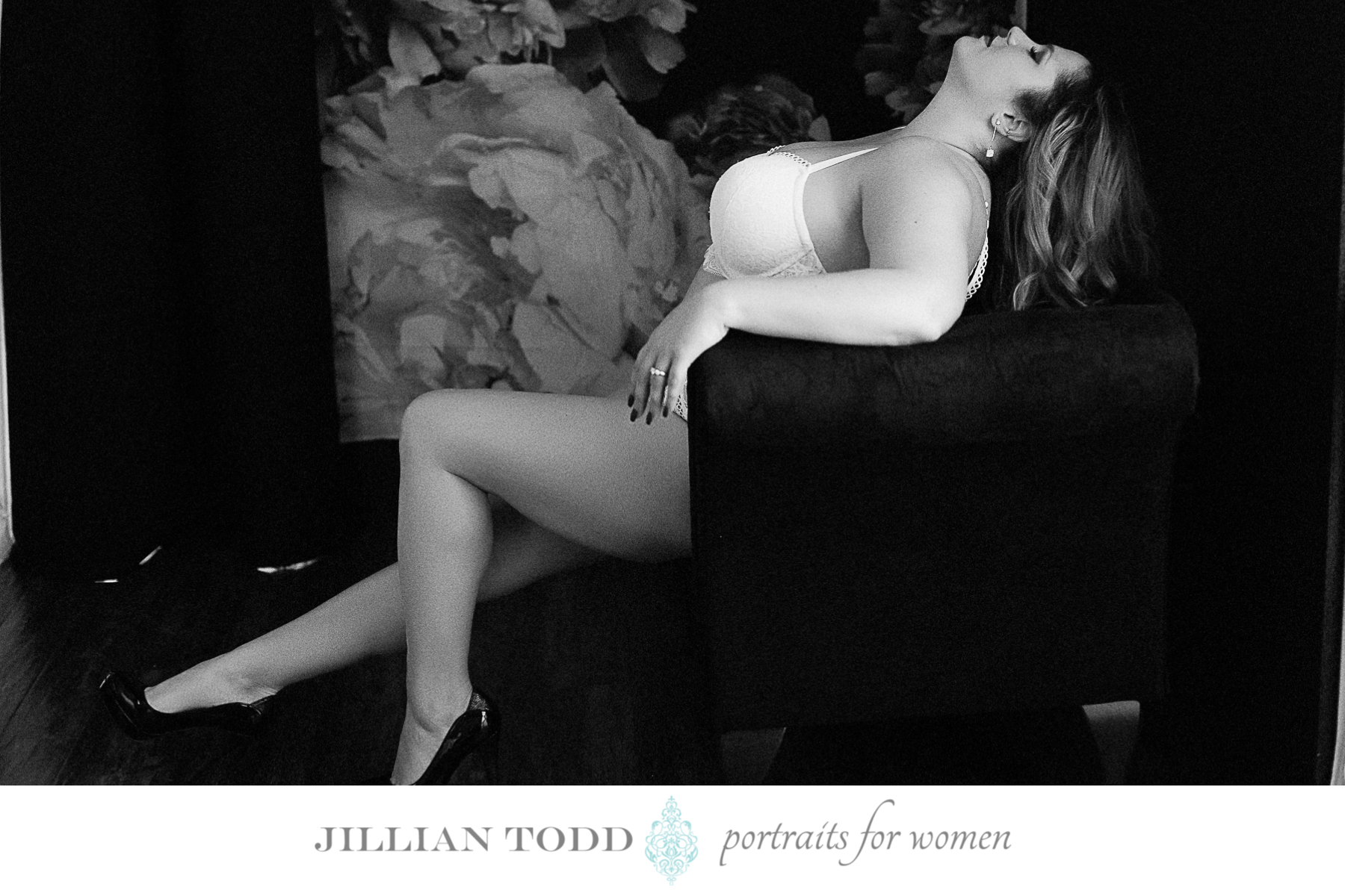 black and white photo of woman posing sensual at boudoir session