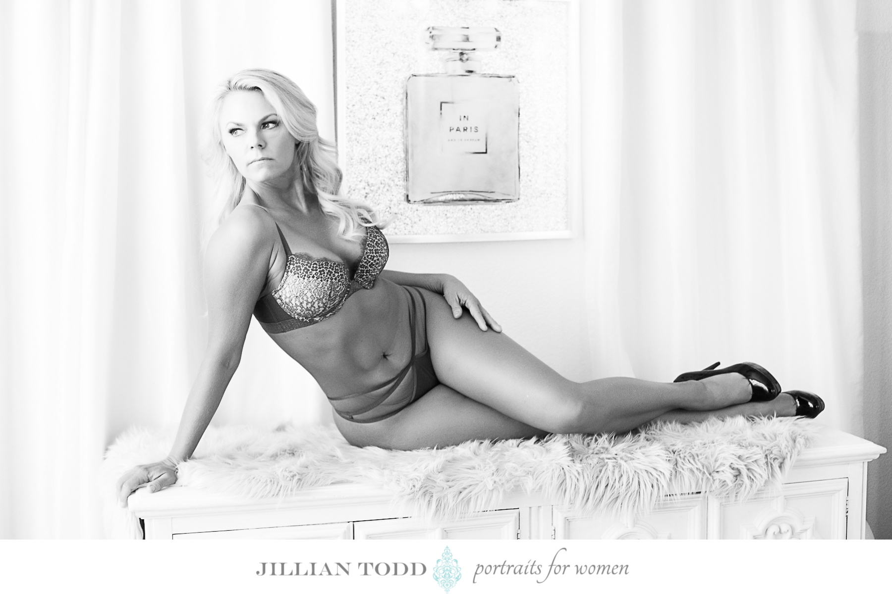 black and white image of blonde posing at boudoir auburn photoshoot