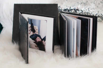 boudoir photo albums staged on fur blanket for creative boudoir gift ideas